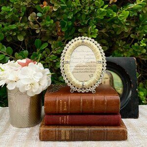 Jay Strongwater opalescent white oval frame with brilliant Swarovski chrystals